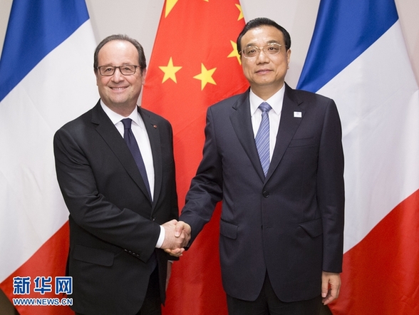 9月20日，国务院总理李克强在纽约会见法国总统奥朗德。新华社记者黄敬文摄 
